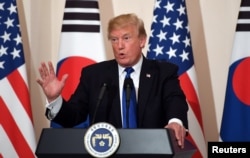 U.S. President Donald Trump gestures as he speaks during a joint press conference with South Korea's President Moon Jae-in (not pictured) at the presidential Blue House in Seoul, South Korea, Nov. 7, 2017.
