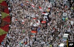 Thousands of Muslims gather during a protest against Jakarta's minority Christian Governor Basuki "Ahok" Tjahaja Purnama who is being prosecuted for blasphemy, at the National Monument in Jakarta, Indonesia, Friday, Dec. 2, 2016.