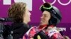 Switzerland's Iouri Podladtchikov (l) celebrates with Shaun White of the United States after Podladtchikov won the gold medal in the men's snowboard halfpipe final in Sochi, Feb 11, 2014.