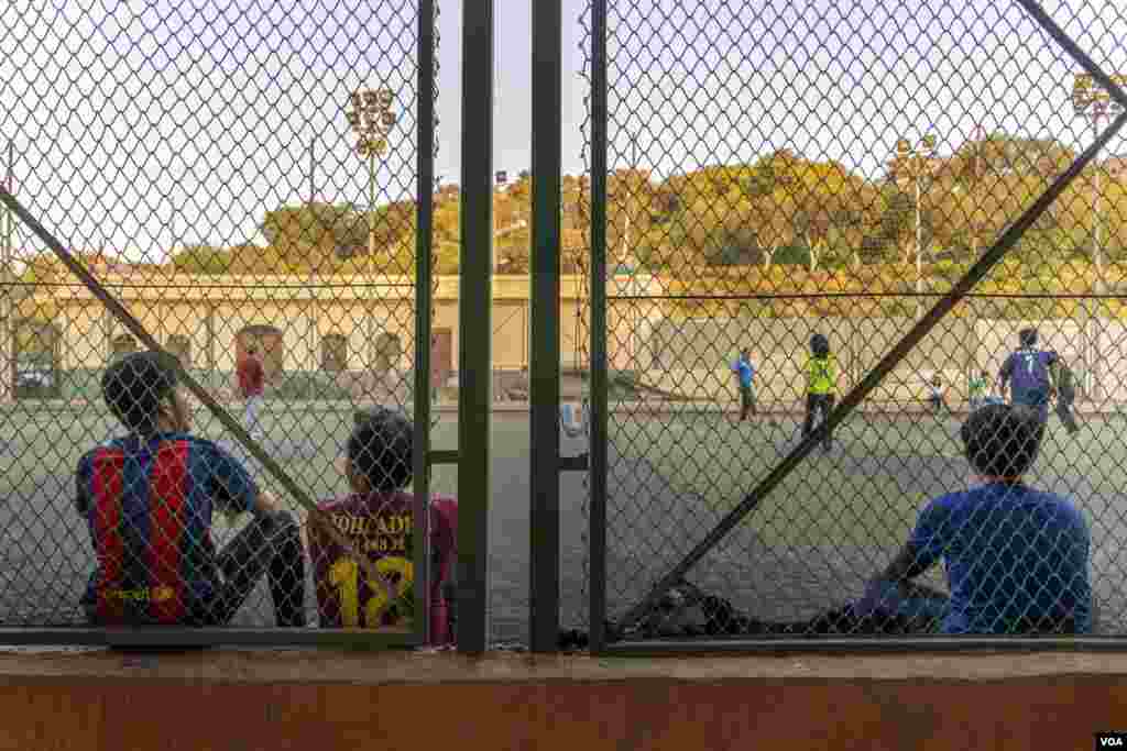 Tall fences, unaffordable ticket prices, and exhausting labor conditions stand between child workers and Cairo’s sporting clubs, Aug. 11, 2021. (Hamada Elrasam/VOA)