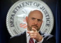 U.S. Attorney for District of Massachusetts Andrew Lelling announces indictments in a sweeping college admissions bribery scandal, during a news conference, March 12, 2019, in Boston.