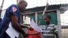 Moses Duo, 9, receives a certificate for being cured of the Ebola virus in Paynesville, Liberia, July 20, 2015. 