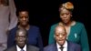Zimbabwe's President Robert Mugabe, front left, and South Africa's President Jacob Zuma, front right, enter the Union building in Pretoria, April 8, 2015. Also pictured are Zimbabwe's first lady Grace Mugabe, rear left, and South Africa's first lady Thobe