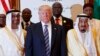 FILE - President Donald Trump poses for photos with King Salman and others at the Arab Islamic American Summit, at the King Abdulaziz Conference Center, May 21, 2017, in Riyadh, Saudi Arabia.