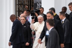 Pope Francis waves to wellwishers as he leaves after a meeting at the Cathedral of the Immaculate Conception in the capital Maputo, Mozambique Thursday, Sept. 5, 2019.