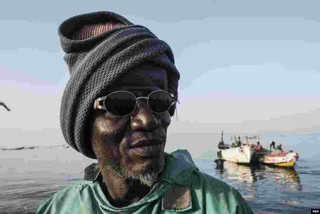 Alioune Thiaw joked he was 300 years old when asked. (He's actually about 65.) He has been working as a fish reseller for about 50 years. Joal, Senegal, May 30, 2017. (R. Shryock/VOA)