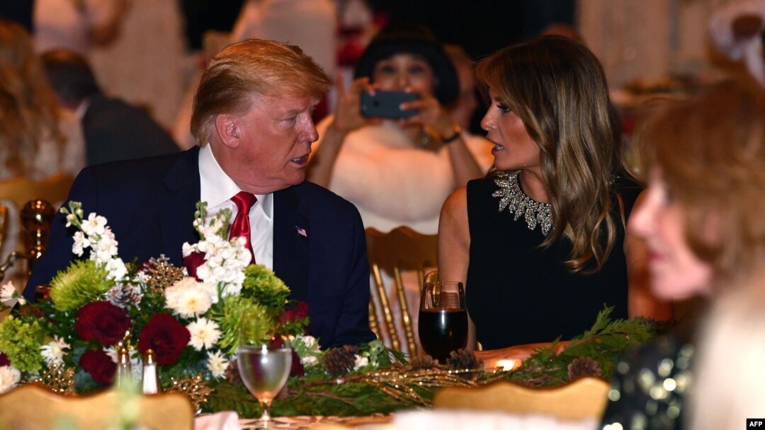 U.S. President Donald Trump and first lady Melania Trump attend a Christmas Eve dinner with his family at Mar-a-Lago in Palm Beach, Fla., Dec. 24, 2019.