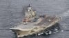 A photo taken from a Norwegian surveillance aircraft shows Russian aircraft carrier Admiral Kuznetsov in international waters off the coast of northern Norway, Oct. 17, 2016.