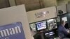 A trader works in the Goldman Sachs booth on the floor of the New York Stock Exchange, March 15, 2012.
