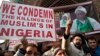 FILE - Kashmiri Shiite Muslims shout slogans against the Nigerian government in Srinagar, Indian-controlled Kashmir, Dec. 18, 2015