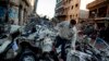 FILE - An Egyptian man makes his way through rubble at the scene of an explosion at a police headquarters building in the Nile Delta city of Mansoura, Egypt, Dec. 24, 2013. 