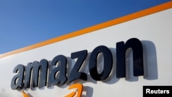 FILE PHOTO: The logo of Amazon is seen at the company logistics centre in Boves, France, August 8, 2018. REUTERS/Pascal Rossignol/File Photo