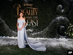 FILE - Emma Watson arrives for the "Beauty And The Beast" premiere in London, Feb. 23, 2017.