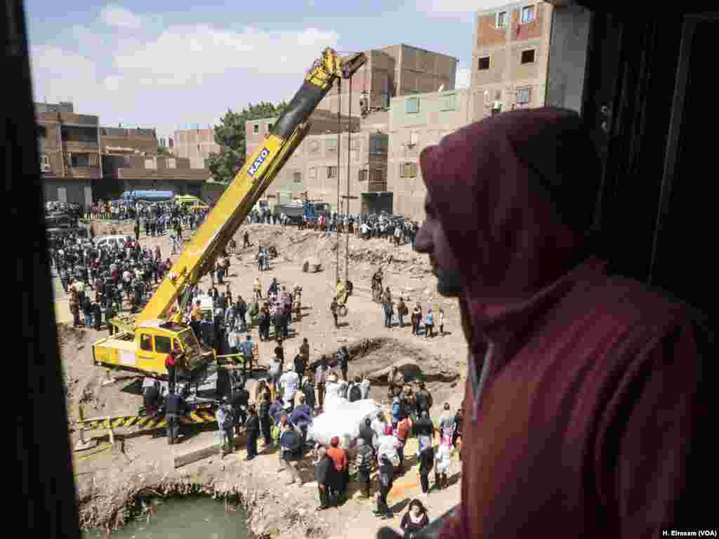 Ahmed watches the excavation of Ramses II statues. He said, “the rest of the statues is under our house, hopefully they pull it, but they have to compensate with us and offer another place to live in."