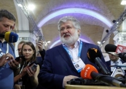 FILE - Ukrainian business tycoon and owner of one of Ukraine's largest media conglomerates, Igor Kolomoisky, speaks with journalists in Kyiv, Ukraine Sept. 13, 2019.