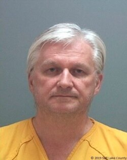 This photo released by the Salt Lake County Sheriff's Office shows Ron Rockwell Hansen, a former U.S. intelligence officer who pleaded guilty to trying to sell secrets to China.