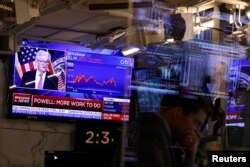 FILE PHOTO: Federal Reserve Chair Jerome Powell interest rate announcement on the trading floor at New York Stock Exchange (NYSE) in New York City
