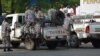 FILE - Burundi policemen patrol the street following a grenade attack in Bujumbura, Burundi. Among the groups not invited to the Arusha talks is the National Council for the Restoration of the Arusha Accord, also known as CNARED.