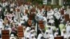 FILE - "Capitalism sucks the peoples' blood" and "Uphold Sharia and Islamic government," Indonesian members of Hizbut Tahrir, a conservative Islamic group, protest against capitalism, Jakarta, Indonesia. 