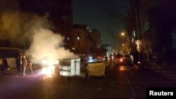 FILE - People protest in Tehran, Iran, Dec. 30, 2017 in this picture obtained from social media.