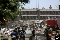 FILE - Security forces inspect near the site of an explosion where German Embassy is located in Kabul, Afghanistan, May 31, 2017.