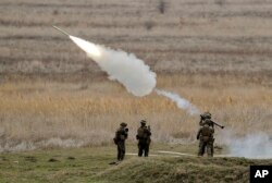 US Marines launch a Stinger missile at the Capu Midia Surface to Air Firing Range, on the Black Sea coast in Romania, Monday, March 20, 2017. (AP Photo/Vadim Ghirda)