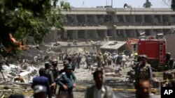FILE - Security forces inspect near the site of an explosion where German Embassy is located in Kabul, Afghanistan, May 31, 2017. A massive explosion rocked a highly secure diplomatic area of Kabul on Wednesday morning, causing scores of casualties.
