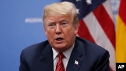 FILE - President Donald Trump speaks to media at the G-20 summit, in Buenos Aires, Argentina, Dec. 1, 2018.