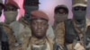 Captain Ibrahim Traore looks on during the announcement on television that he has ousted Burkina Faso's military leader Paul-Henri Damiba and dissolved the government and constitution, in Ouagadougou