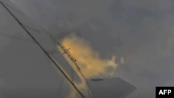 This photo screengrab made from SpaceX's live webcast shows the Starship SN11 as it took to the skies over Texas on March 30, 2021 following a 24-hour delay.