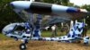 Rangers look at an anti-poaching aircraft named Seeker, which is being shown to reporters at the Kruger National Park, December 4, 2012.