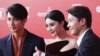 2015年6月13日，中国女演员，歌手兼制片人范冰冰、香港演员兼歌手黎明（右）和台湾演员吴尊走上上海国际电影节开幕式的红地毯 。范冰冰是中国最大和最富有的影视明星之一，她2018年8月已经从公众视野中消失，当局调查演艺人员的涉嫌逃税行为，引发关于她命运的越来越多的传说。