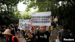 Teachers protest against the extradition bill during a rally organized by Hong Kong Professional Teachers' Union in Hong Kong, Aug. 17, 2019. 