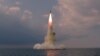 북한이 지난해 10월 19일 신형 잠수함발사탄도미사일(SLBM)을 시험발사했다며 공개한 사진.