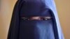 FILE - Fatima, 14, poses at the Elman Centre in Mogadishu, March 24, 2015. After Fatima was raped by a tuk-tuk driver, she was arrested, detained for a month and raped repeatedly by a police officer, she and her aunt said. 