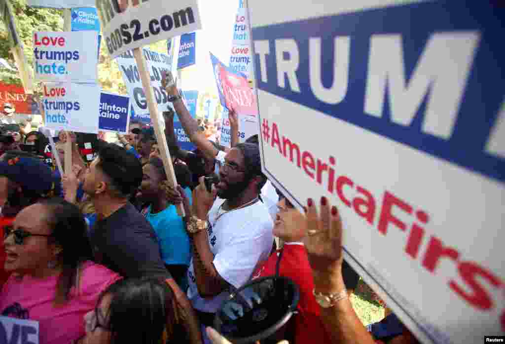Opposing groups of protesters gather during demonstrations on the campus of University of Nevada, Las Vegas before the last 2016 U.S. presidential debate in Las Vegas, Oct. 19, 2016.