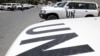 Vehicles belonging to United Nations observers are parked in front of a hotel in Damascus July 2, 2012. 