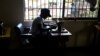 FILE - A victim of human trafficking in Libya sews clothes in Benin, Edo State, Nigeria, Oct. 21, 2016. Human Rights Watch says in a new report that Nigerian trafficking survivors are not getting enough support from their government.