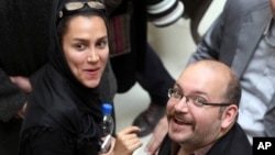 FILE - Jason Rezaian and his wife Yeganeh Salehi. 