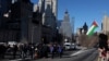 Pro-Palestinian demonstrators are taken into custody by the NYPD after blocking a Brooklyn Bridge roadway during a 'Shut it Down for Palestine' protest in New York City