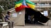 A boy sits outside a polling station, as Ethiopia's national election kicks off in capital Addis Ababa, May 24, 2015. 