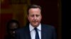 Britain's Prime Minister David Cameron leaves 10 Downing Street in London, to be driven to the Houses of Parliament for a debate and vote on Syria, Aug. 29, 2013. 