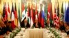 FILE - U.S. Secretary of State John Kerry, top center, Russia's Foreign Minister Sergei Lavrov, top right, and other foreign ministers and officials attend a meeting on Syria, in Vienna, Austria, Nov. 14, 2015.