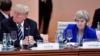 Presiden AS Donald Trump dan PM Inggris Theresa May dalam KTT G20 di Hamburg, Jerman Juli tahun lalu. Dalam beberapa hari ini May telah berulang kali berbicara dengan Trump mengenai penegakan "larangan penggunaan senjata kimia".