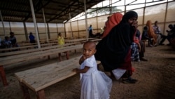 FILE: Some of around 20 Somali refugee families wait to be flown to Kismayo in Somalia, under a voluntary repatriation program, at the airstrip of Dadaab refugee camp, hosting over 230,000 inhabitants, in northern Kenya, Dec. 19, 2017