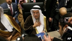 FILE - Saudi Arabia Minister of Petroleum and Mineral Resources Ali Ibrahim Naimi speaks to journalists before a meeting of the Organization of the Petroleum Exporting Countries, OPEC, at their headquarters in Vienna, Austria, Dec. 4, 2015. 