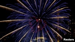 Fireworks explode over Chao Phraya River during the New Year celebrations amid the spread of the coronavirus disease (COVID-19) in Bangkok, Thailand, January 1, 2021. 