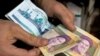 حذف «دلار ۴۲۰۰ تومانی»؛ پیشنهاد نماینده مجلس: کارت یارانه و بن خرید کالاهای اساسی توزیع شود