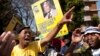 Members of the ruling party youth league sing outside the Mediclinic Heart Hospital where former South African President Nelson Mandela was being treated in Pretoria, South Africa, July 17, 2013. 