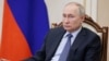 FILE PHOTO: Russian President Putin chairs a meeting on the social and economic development of Crimea and Sevastopol, in Moscow